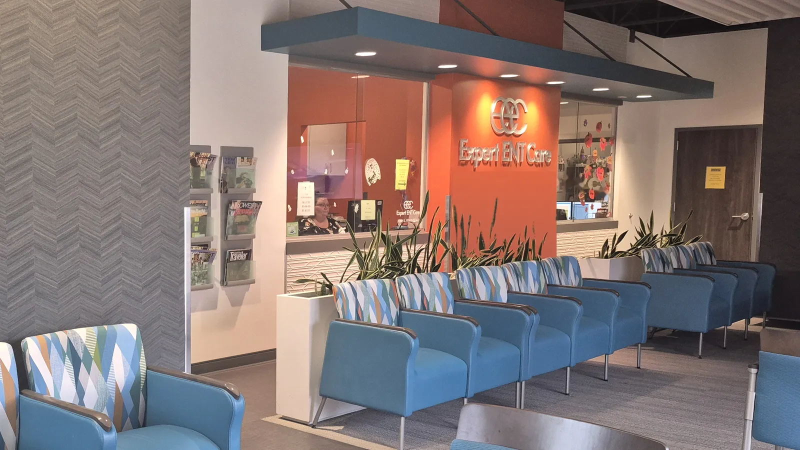 The Fort Worth waiting room, with comfortable blue seating and the front desk
