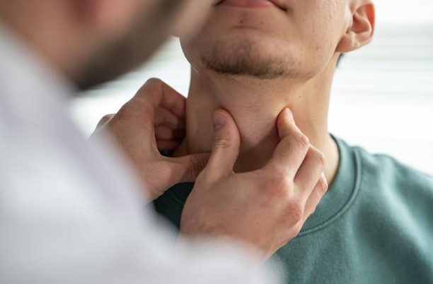 ENT Doctor examining patient's throat